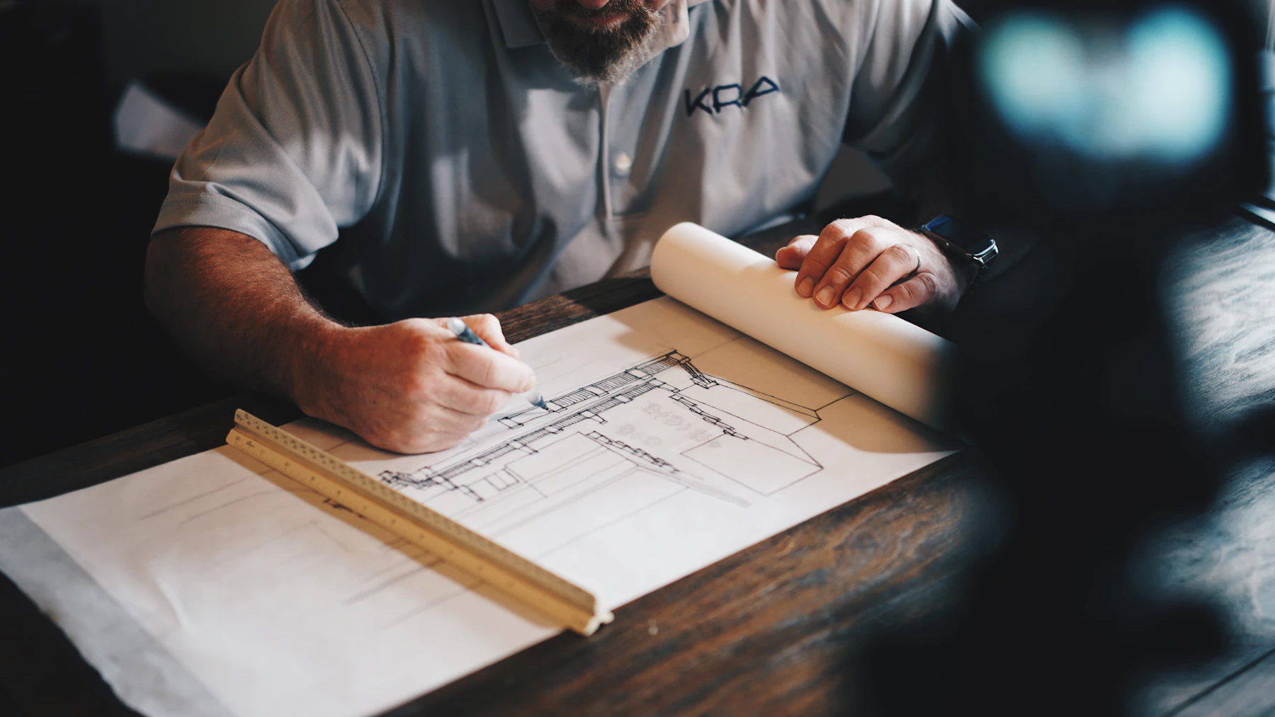 Project team reviewing architectural drawings and material details